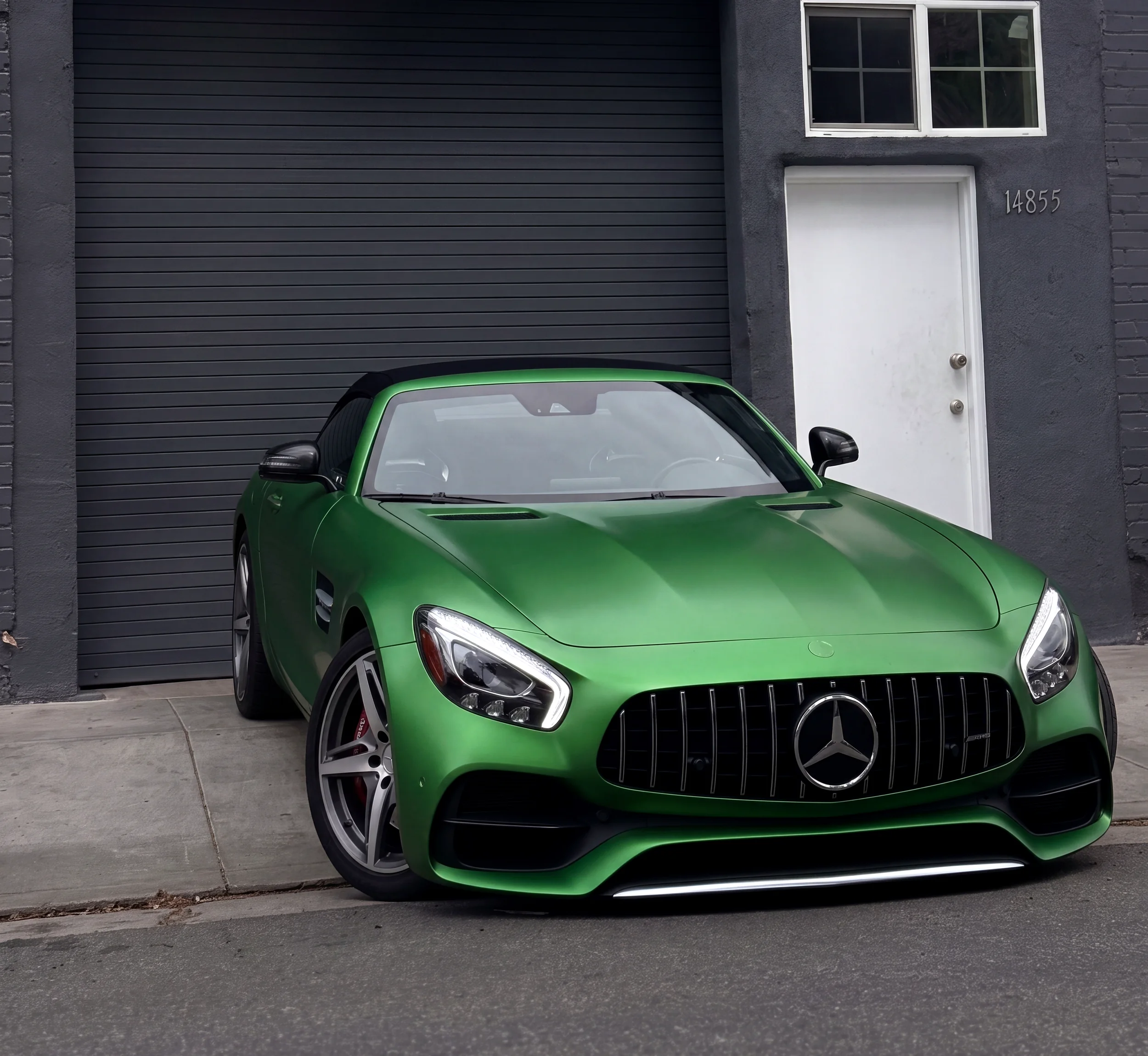 Matte green Mercedes-AMG GT outside the Capital Collision Center shop