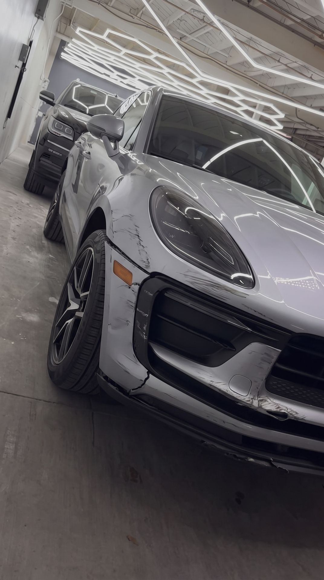 Porsche Macan scraped front bumper