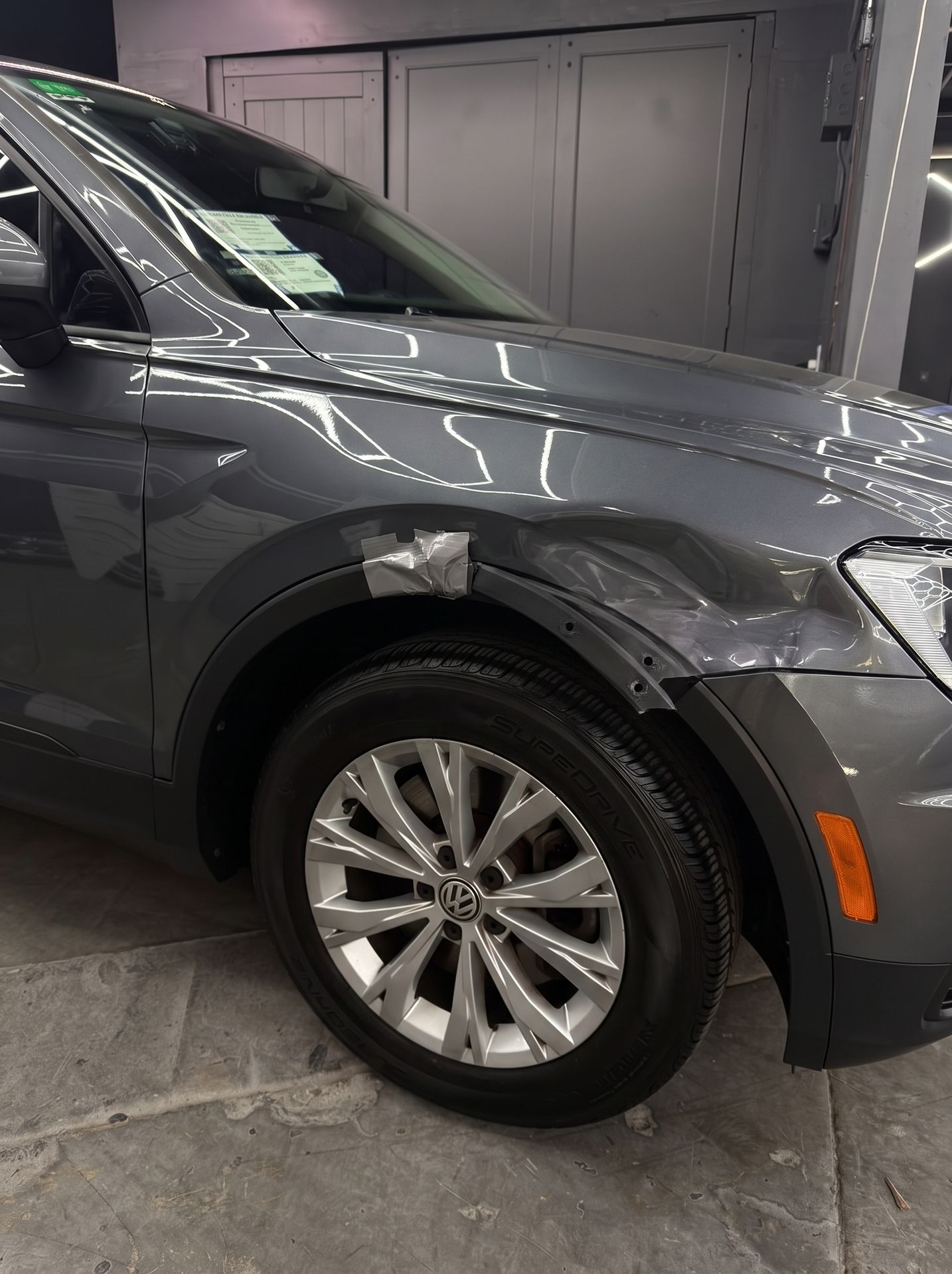 VW Tiguan dented front fender